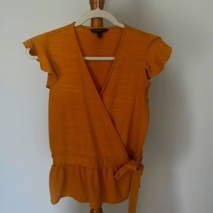 Wrap shirt with ruffled cap sleeve